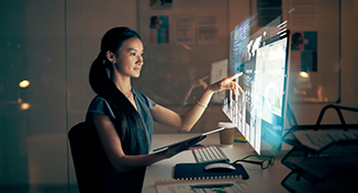 Image of Person reading data on computer screen