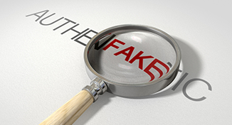 Image of A magnifier on the word fake