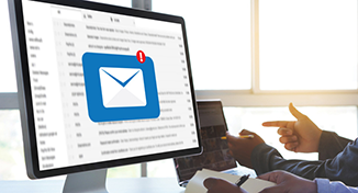 Image of Computer with email logo on screen