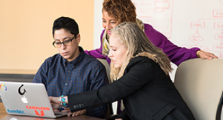 Image of Teacher helping students with their job search